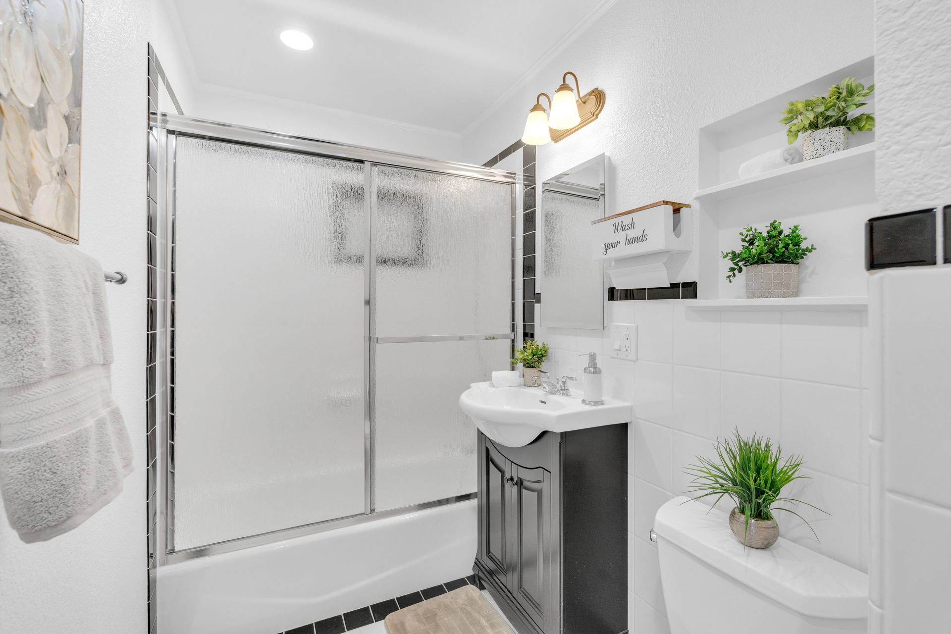 Full bath black and white tile