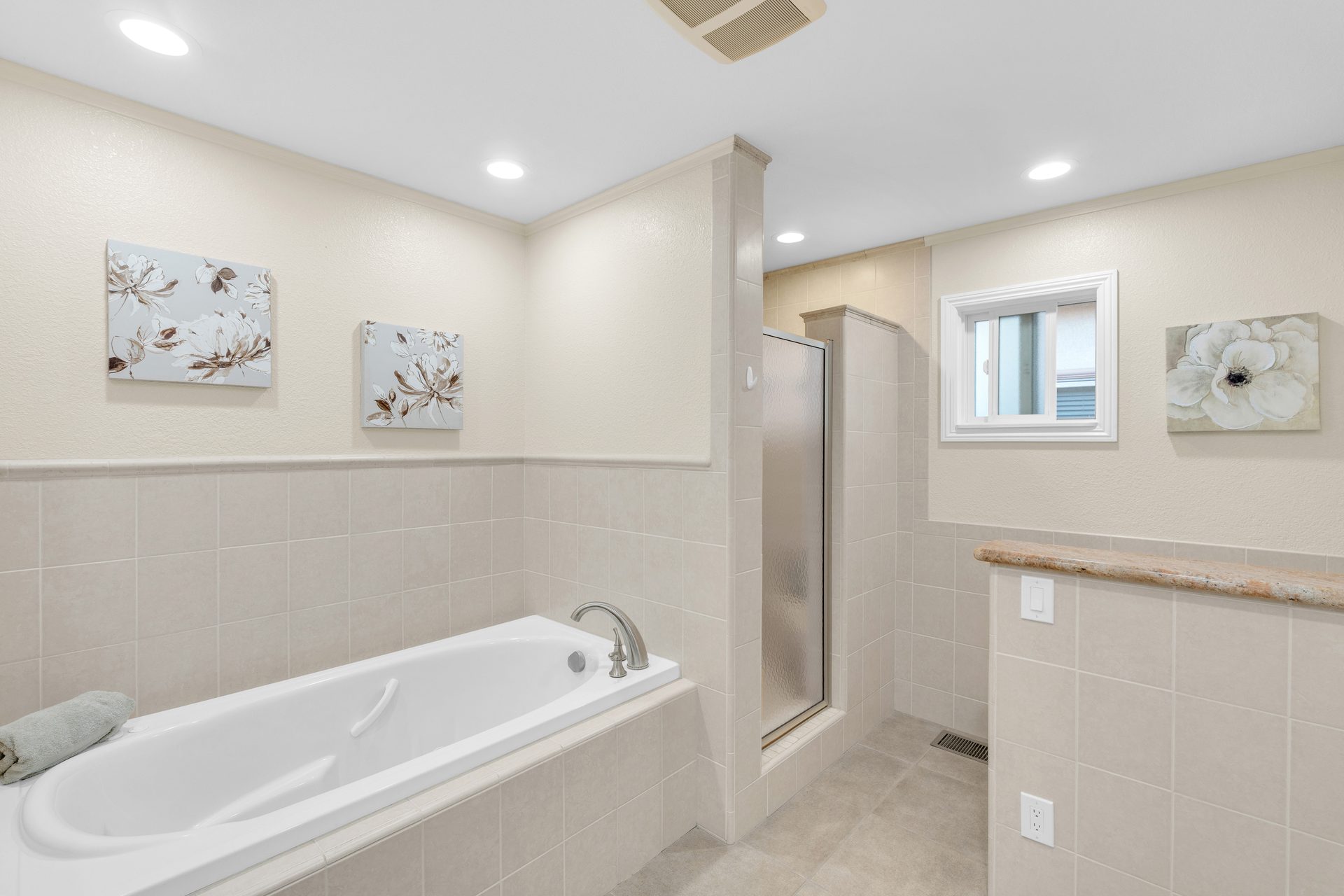 Primary soaking tub and glass shower