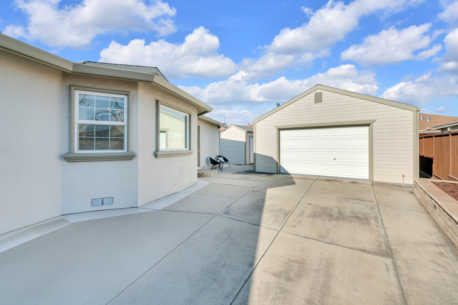 Side yard both garages visible